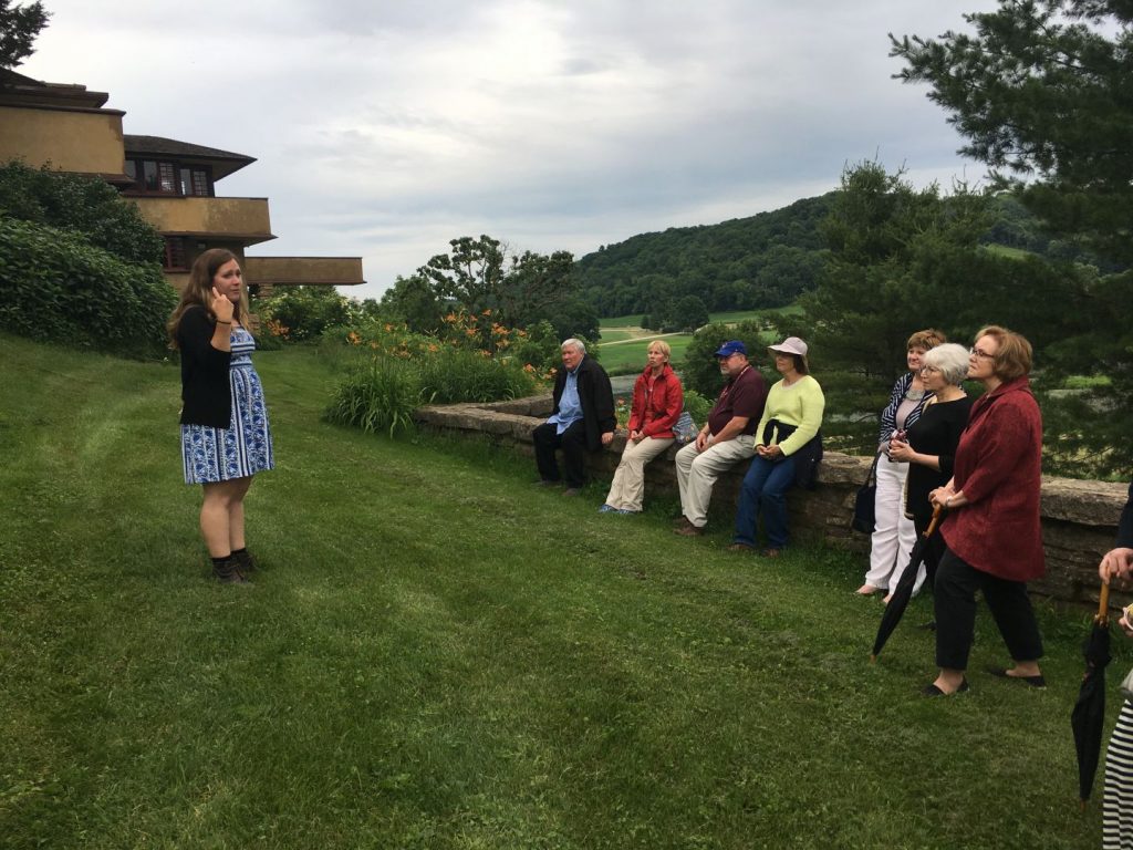 Guests on the Driftless Landscape, sitting while their guide is speaking.